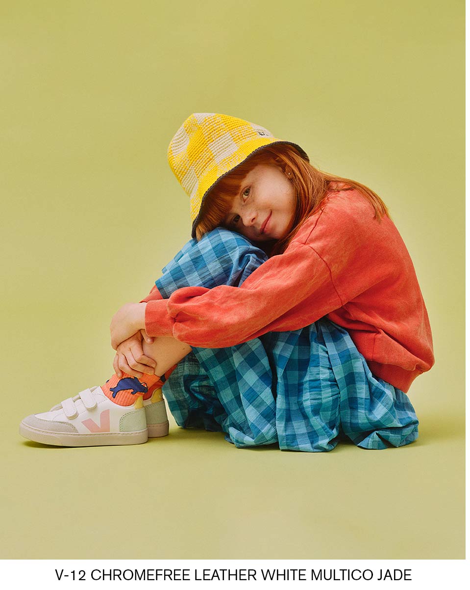 little redhead girl with V-12 white multico jade shoes
