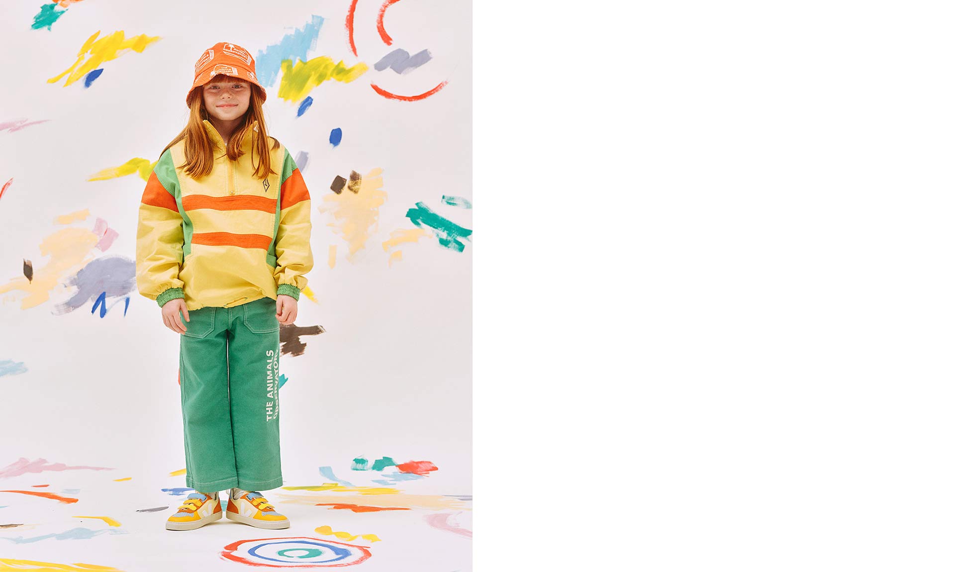 Girl in a colourful studio setting wearing V-10 leather chromefree multico sun shoes