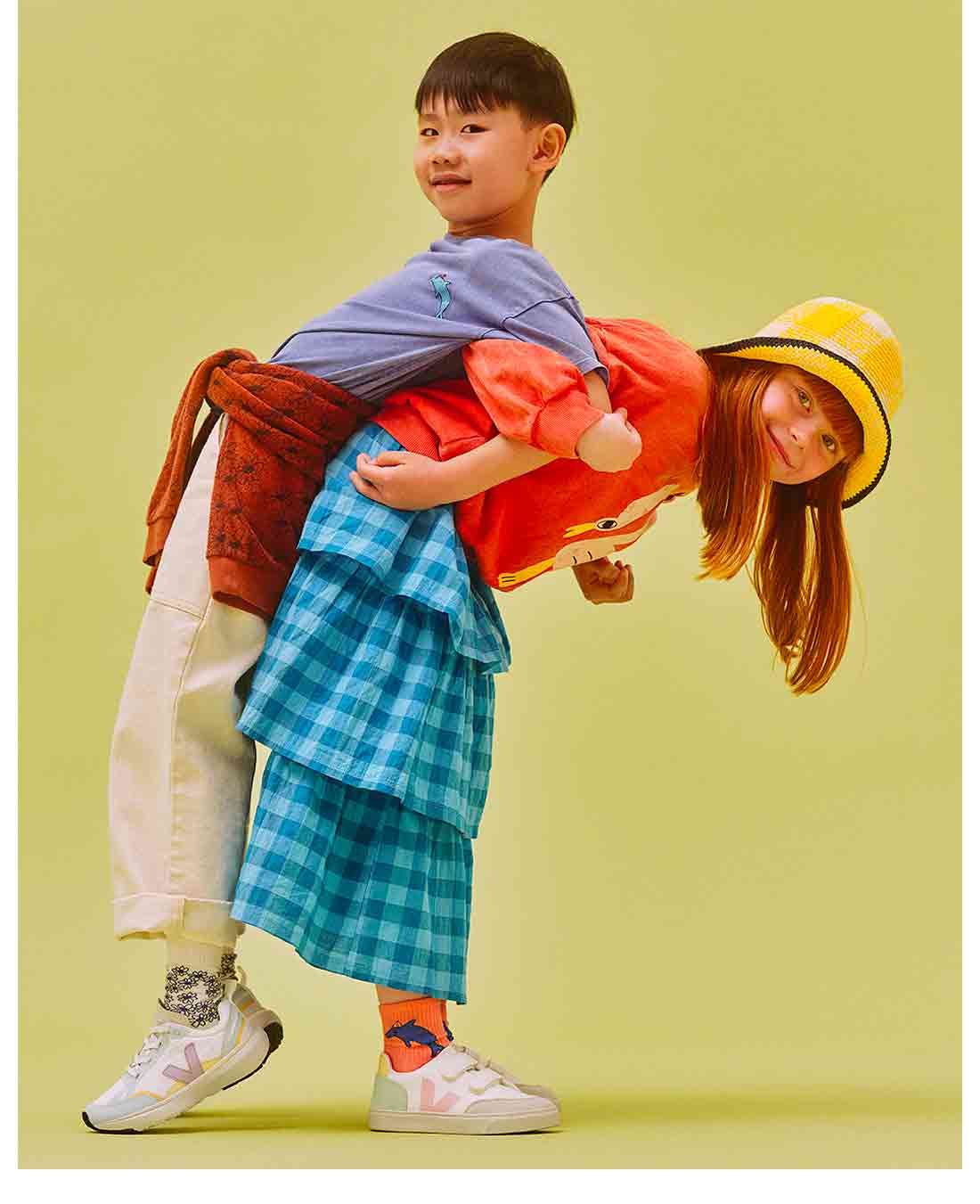 Two children having fun during the shooting for the new kids collection spring-summer 2023