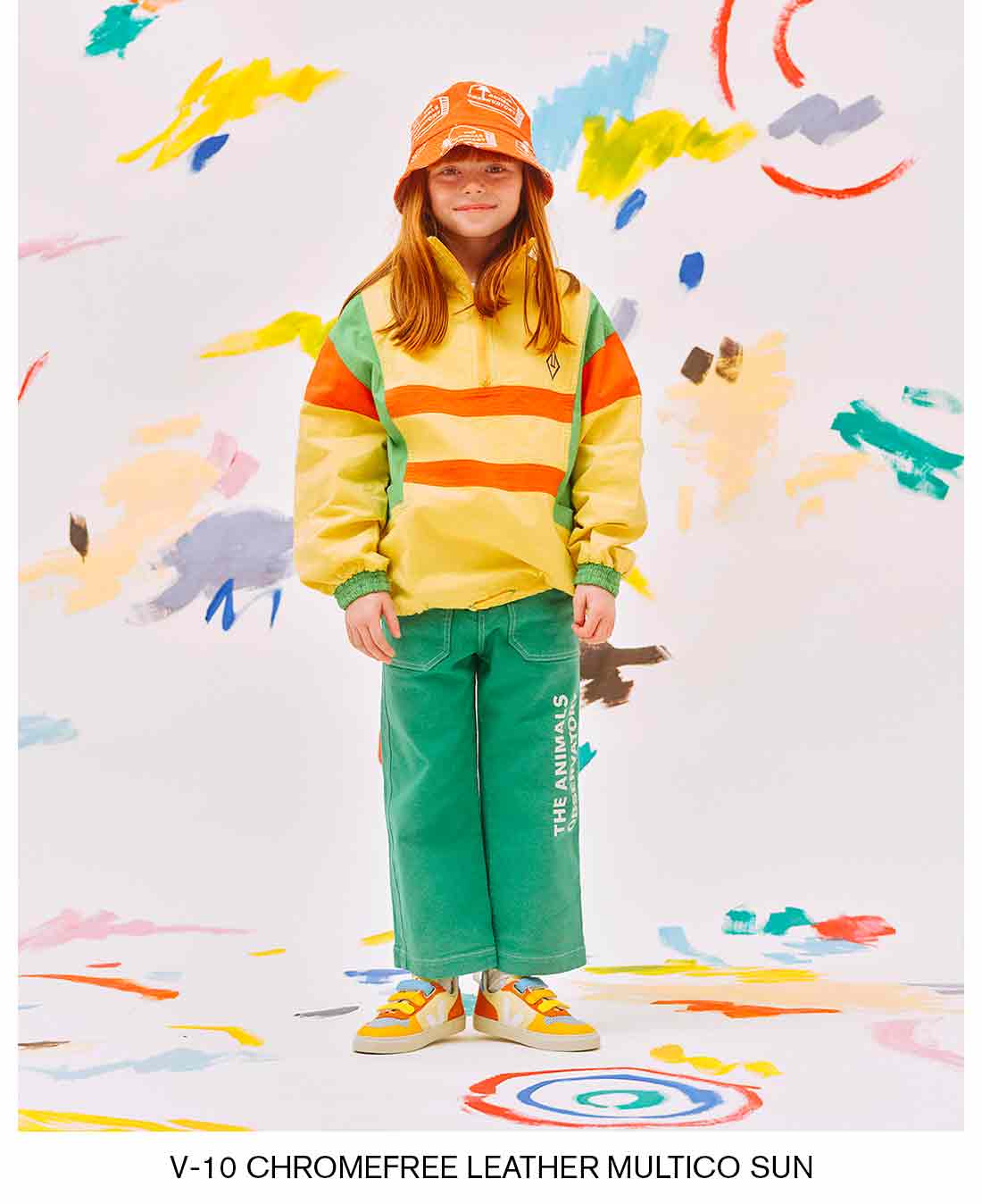 Girl in a colorful studio setting wearing V-10 leather chromefree multico sun sneakers