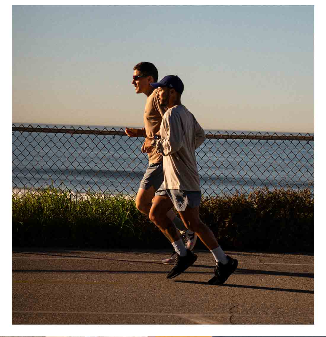 Two men running with VEJA Marlin running shoes